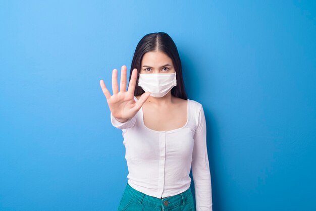 Portrait of young woman is wearing face mask
