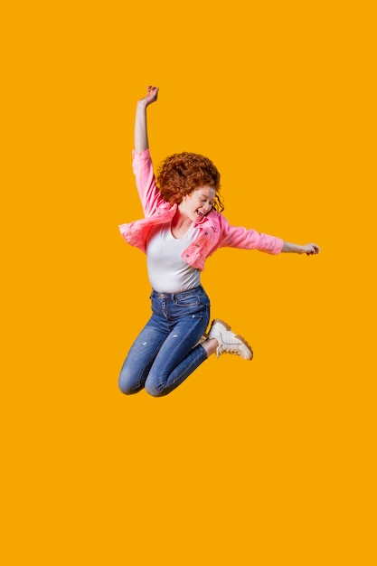 Portrait young woman jumping