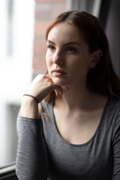 Portrait of a young woman looking away