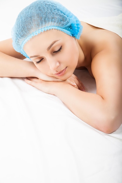 Portrait of a young woman during massage procedure