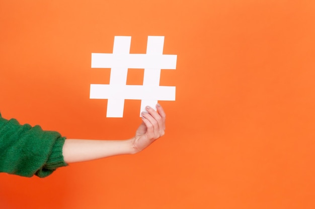 portrait of young woman on orange background