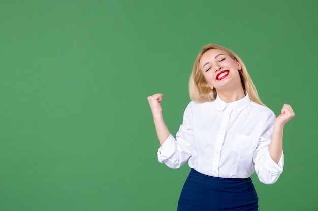 portrait of young woman pleased green wall student college school teacher child color