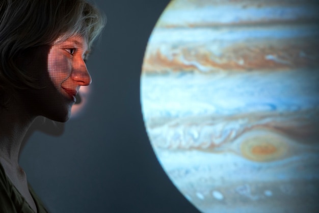 Photo portrait of young woman posing with universe projection texture