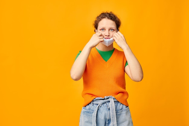 Portrait of a young woman protective medical mask fun posing fashion isolated backgrounds unaltered