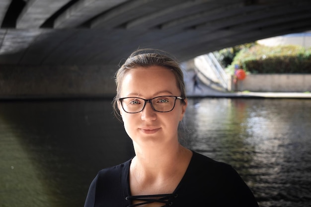 Portrait of young woman in river