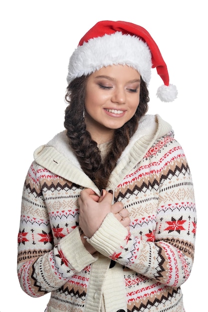 Portrait of young woman in Santa hat