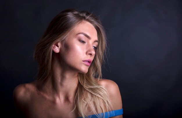 portrait of a young woman shooting in a photo studio