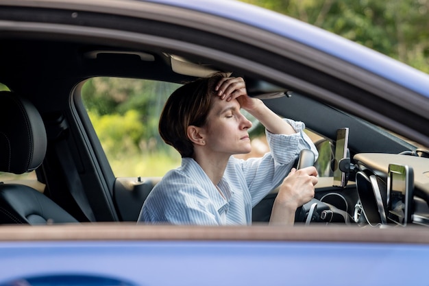 portrait of young woman sitting in car