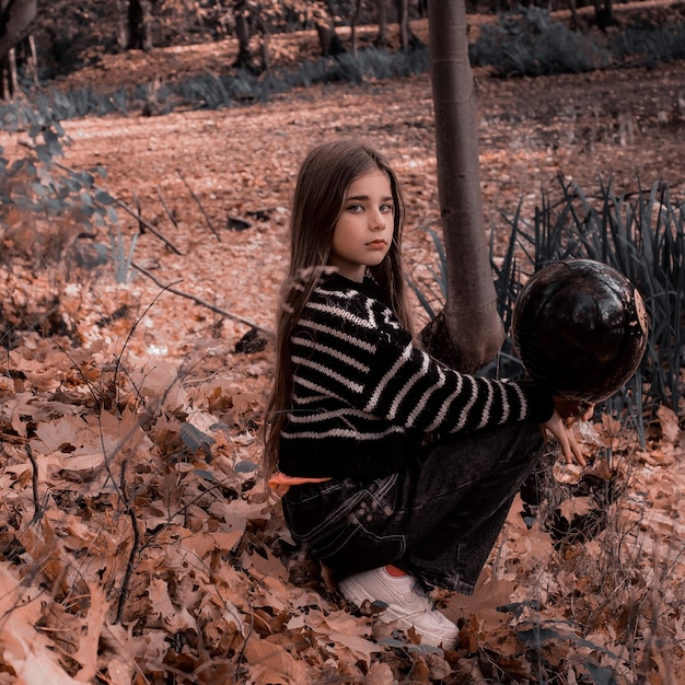 Photo portrait of young woman sitting on field