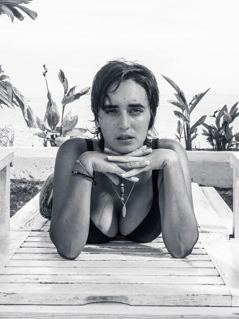 Portrait of young woman sitting outdoors