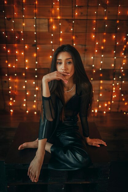 Portrait of young woman sitting on stage