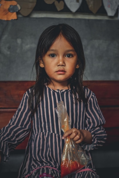 portrait of young woman sitting on table