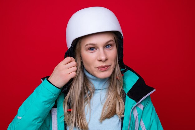 Portrait of a young woman in a ski helmet
