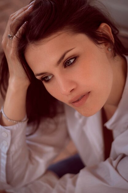 Portrait of young woman sleeping on bed at home