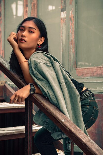 Portrait of young woman on staircase