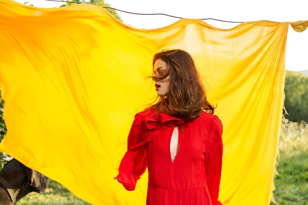 Portrait of young woman standing against tent