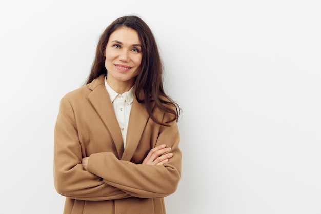 portrait of young woman standing against white background