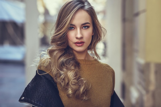 portrait of young woman standing in city