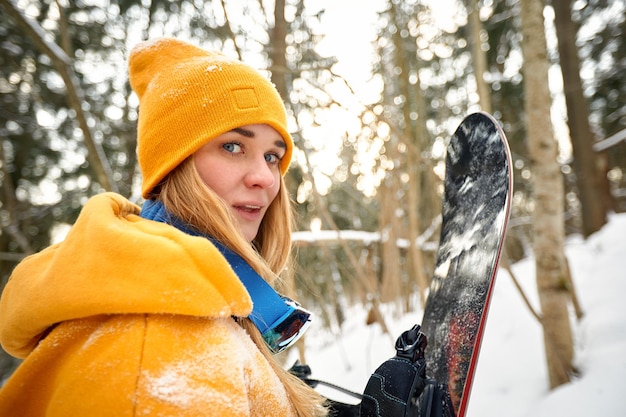 portrait of young woman standing in forest