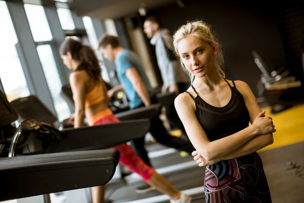 Portrait of young woman standing in the gym