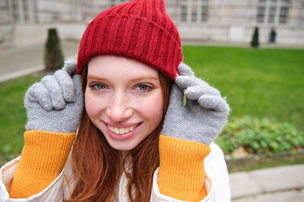 Portrait of young woman standing outdoors