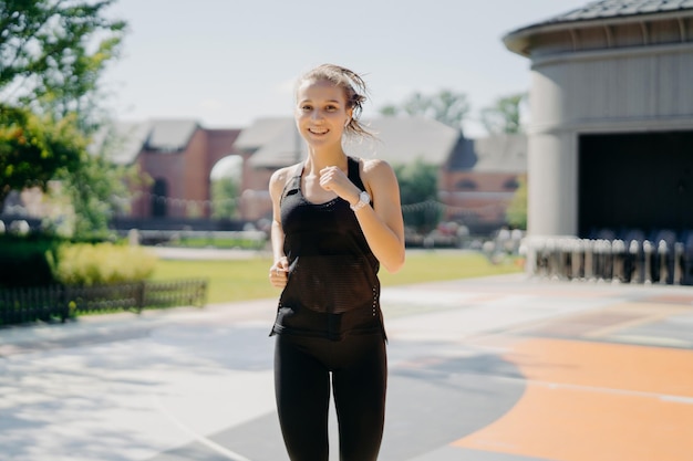 Portrait of young woman standing outdoors