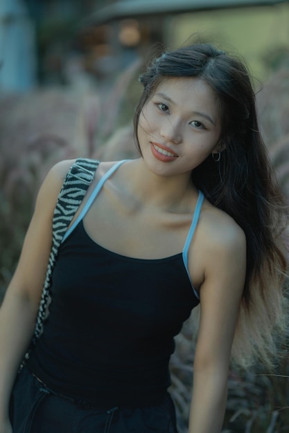 Portrait of young woman standing outdoors