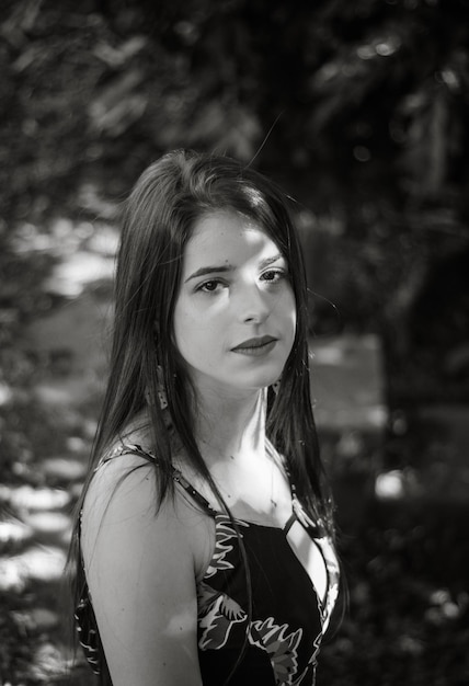 Portrait of young woman standing outdoors