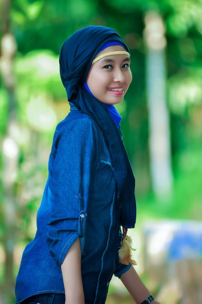 Portrait of young woman standing outdoors