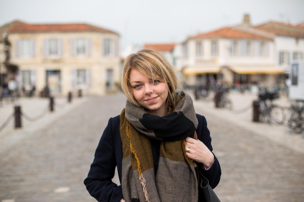 portrait of young woman standing on street