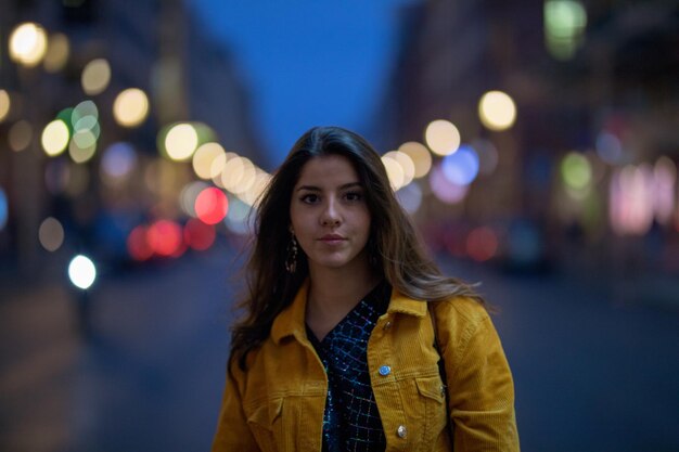 Portrait of young woman on street