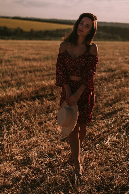 Portrait of a young woman in summer field