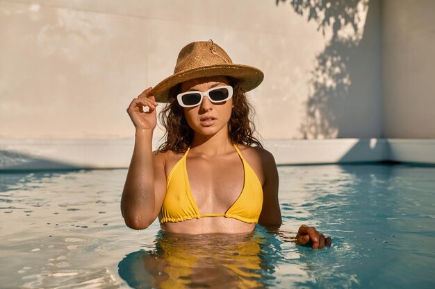 Portrait of young woman in swimming pool