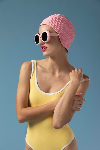 Photo portrait of young woman in swimsuit at the studio