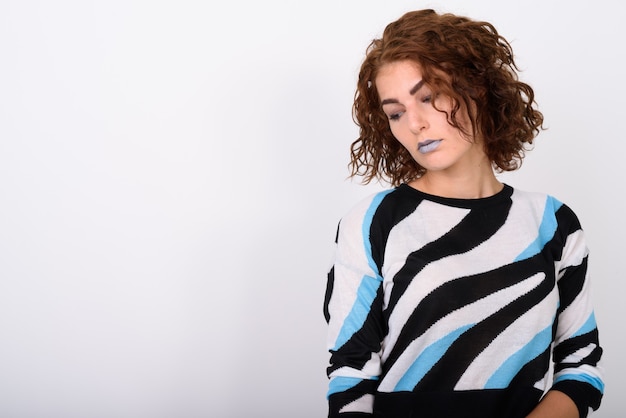 Portrait Of Young Woman Thinking Against White Background