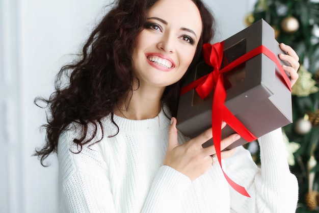 Portrait of young woman using mobile phone