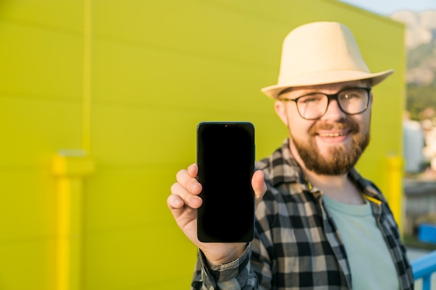 Portrait of young woman using mobile phone