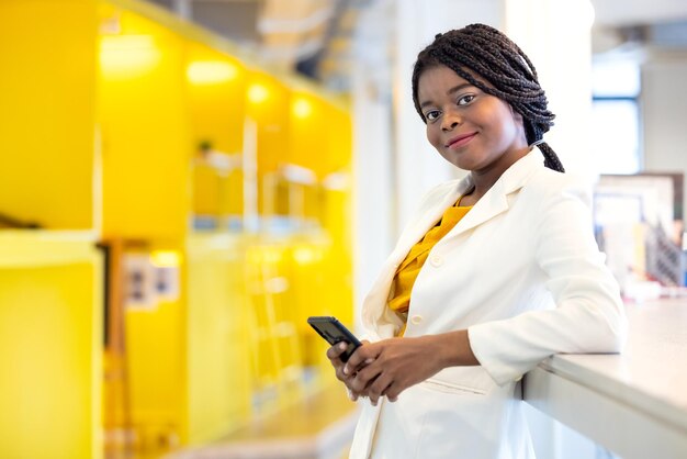 Portrait of young woman using mobile phone