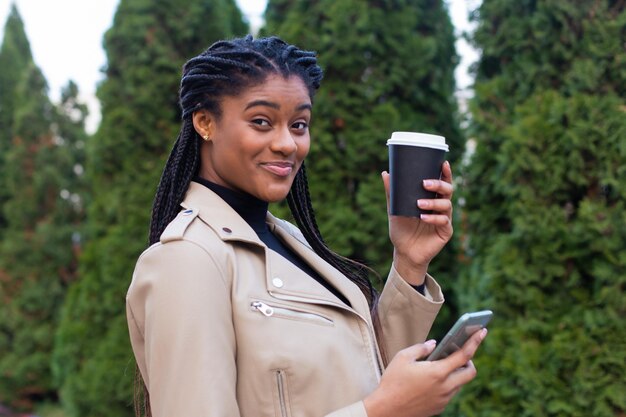 Portrait of young woman using mobile phone