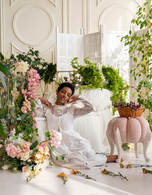 Foto ritratto di giovane donna che indossa un abito boho chic tra i fiori