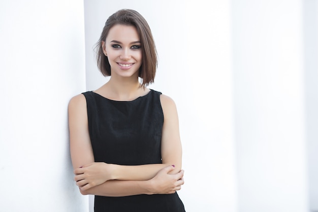 Portrait of a young woman wearing an elegant dress