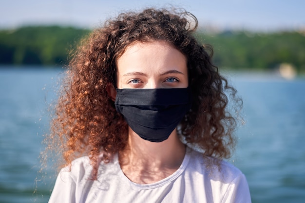 Portrait of a young woman wearing a face mask