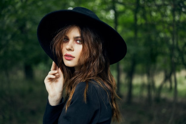 Portrait of young woman wearing hat