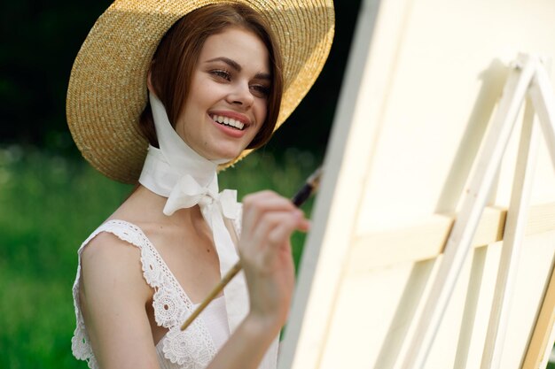 Portrait of young woman wearing hat