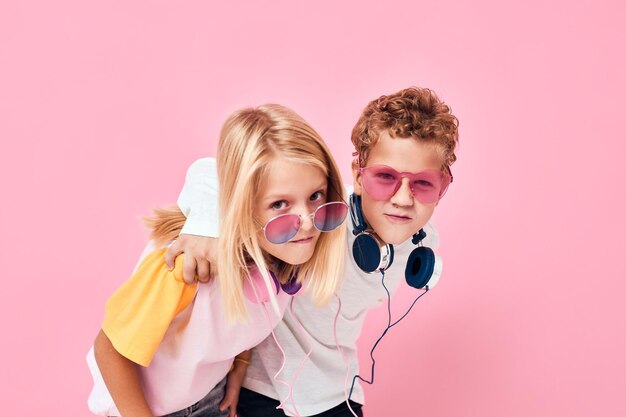 Portrait of young woman wearing mask against pink background