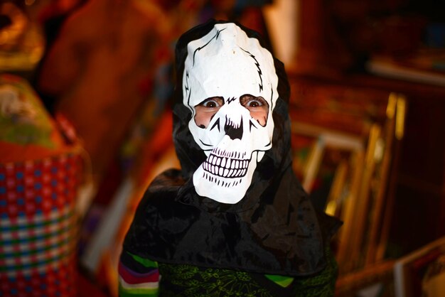 Portrait of young woman wearing mask standing outdoors