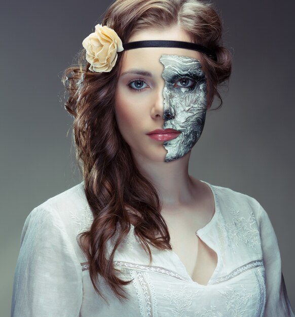 Portrait of young woman wearing a mask