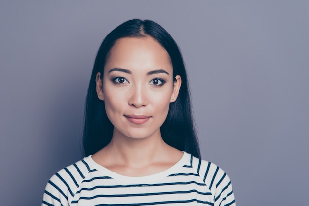 Portrait young woman wearing striped shirt