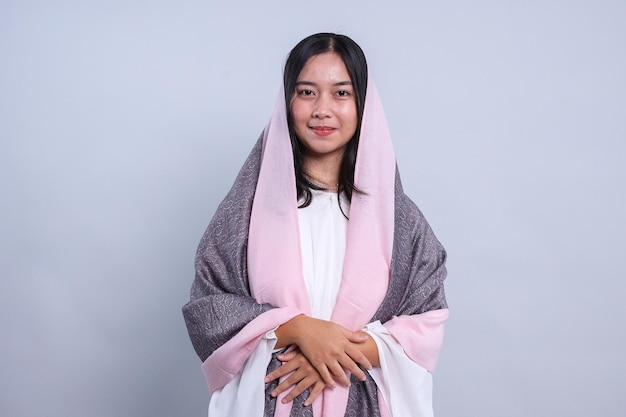 Portrait of Young Woman Wearing Veil Isolated on Gray Background