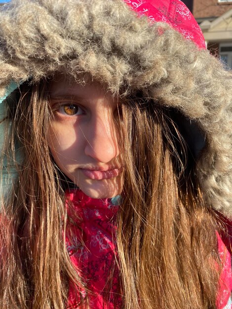 Portrait of young woman wearing warm clothing